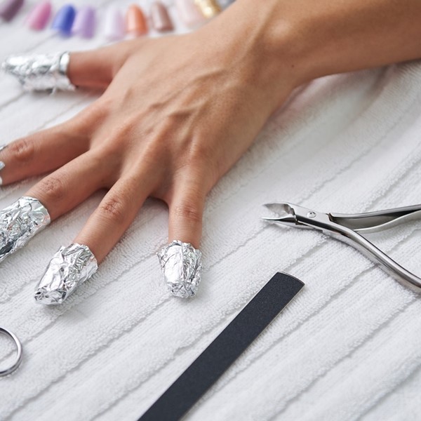 remove nail glue from skin
