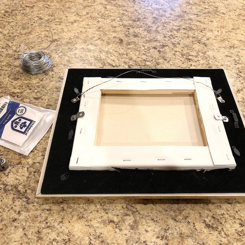 framing a canvas painting