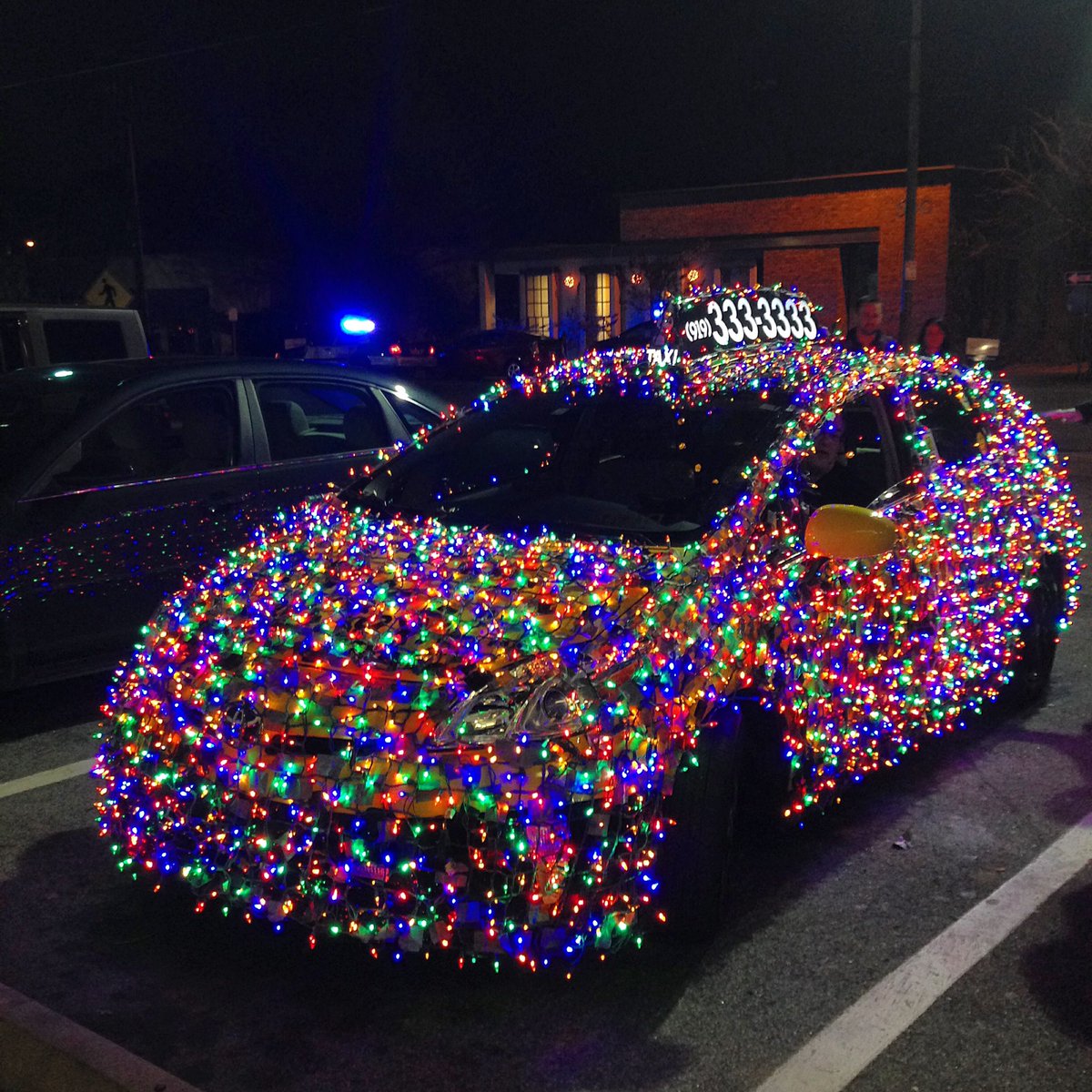 car wrapped in christmas lights