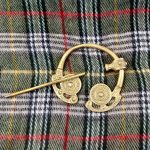 cloak brooch